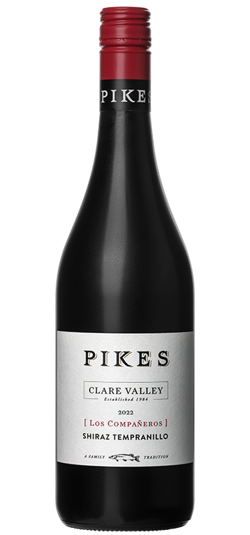 Wine bottle labeled 'Pikes' with a red cap on a white background